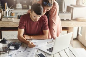 young-couple-doing-their-finances-300×200